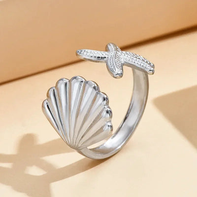 Bague Coquillage Saint-Jacques et Étoile de Mer ajustable Argentée