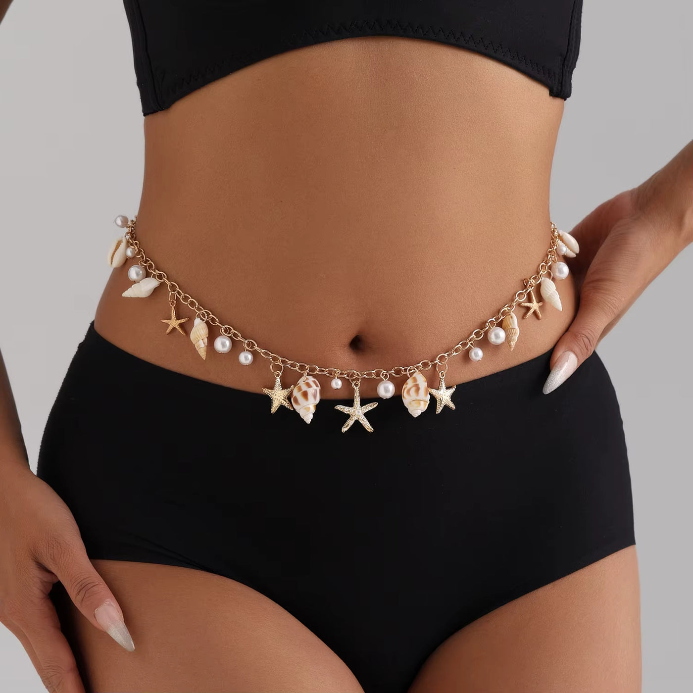 Bijoux de Corps Coquillage avec Perles sur une femme